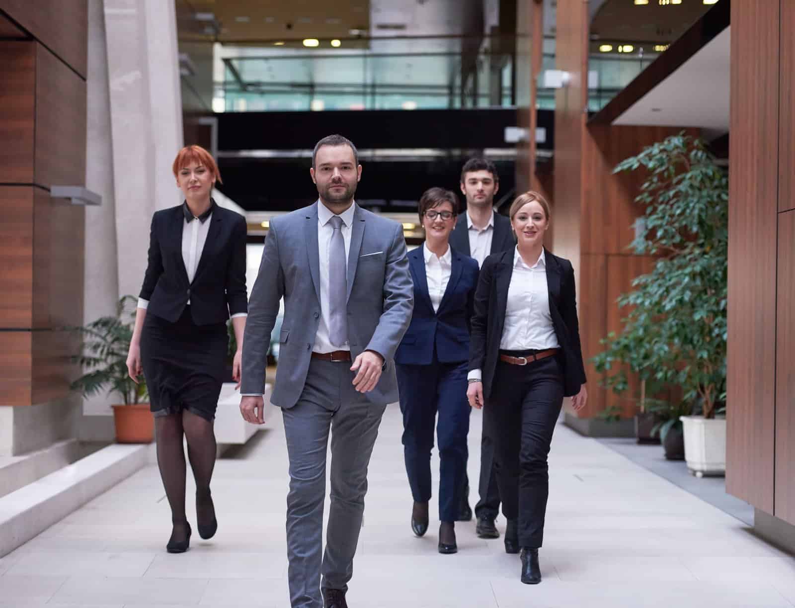 young business people team walking group people modern office hall interior